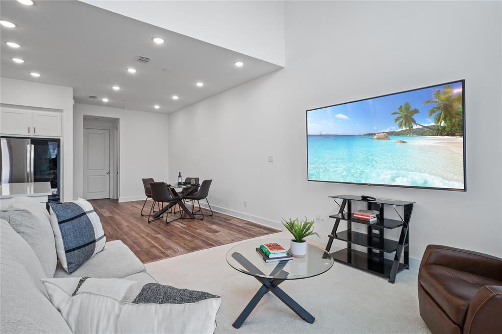 313 Sugar Maple Lane McKinney, TX 75071 - Photo 9 of 40 a living room with furniture and a flat screen tv