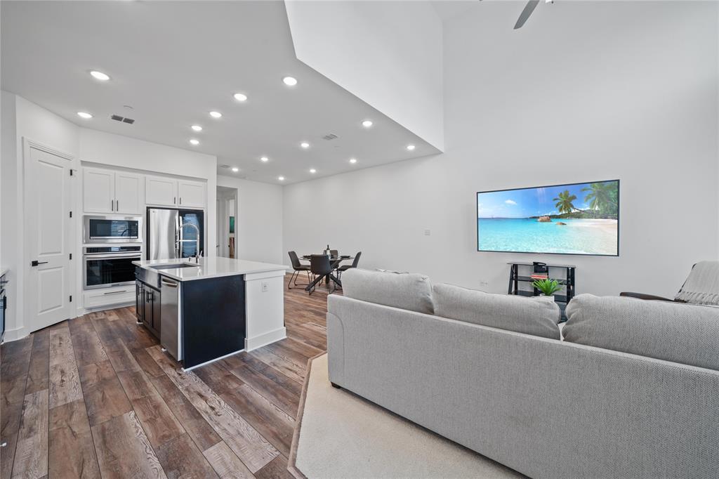 313 Sugar Maple Lane McKinney, TX 75071 - Photo 10 of 40 a living room with furniture and a flat screen tv