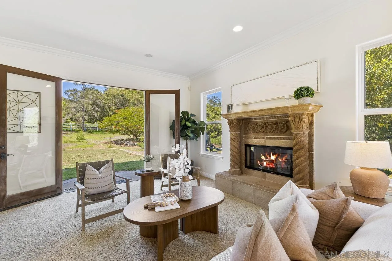 20919 Questhaven Road San Marcos, CA 92078 - Photo 13 of 54 a living room with furniture and a fireplace