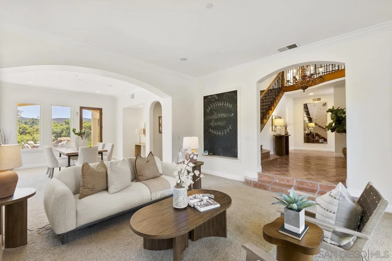 20919 Questhaven Road San Marcos, CA 92078 - Photo 14 of 54 a living room with furniture and a mirror