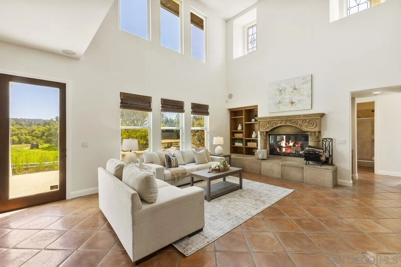 20919 Questhaven Road San Marcos, CA 92078 - Photo 19 of 54 a living room with furniture and a fireplace
