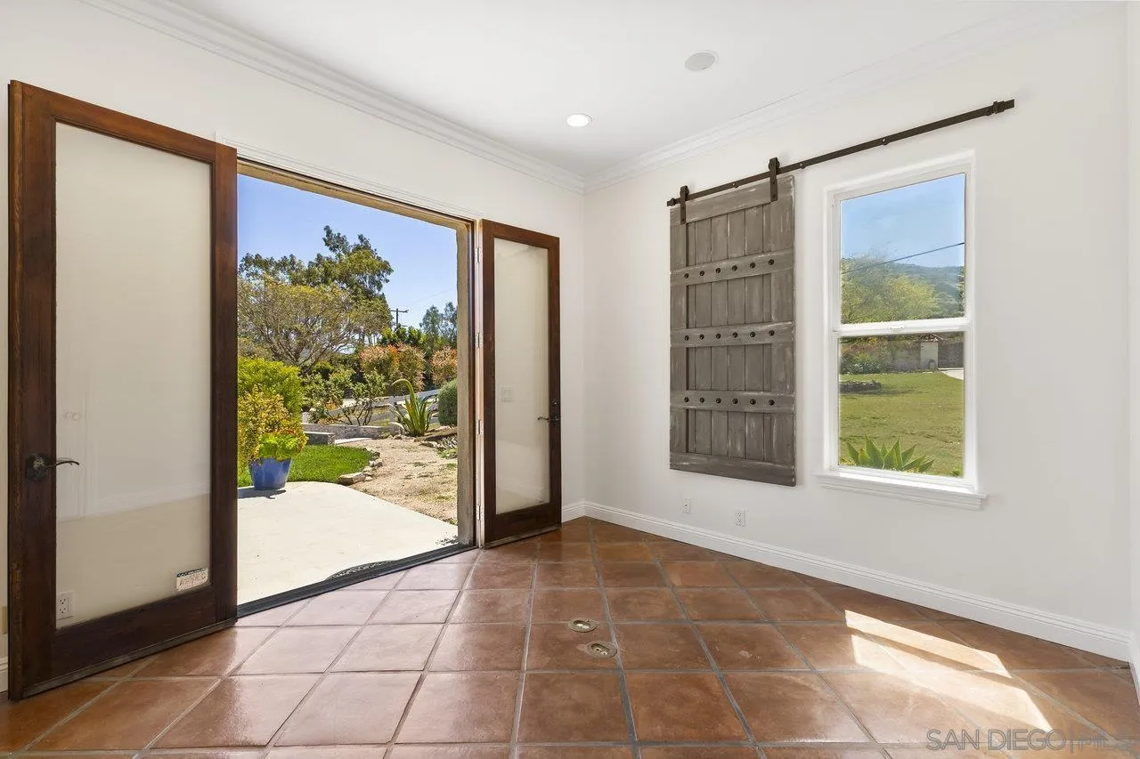 20919 Questhaven Road San Marcos, CA 92078 - Photo 22 of 54 a view of an empty room with a window