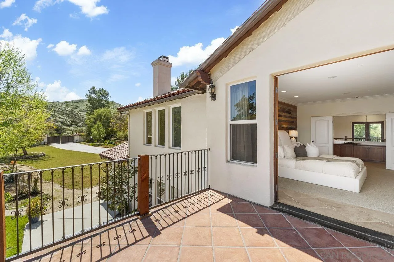 20919 Questhaven Road San Marcos, CA 92078 - Photo 31 of 54 a view of a balcony with wooden floor and fence