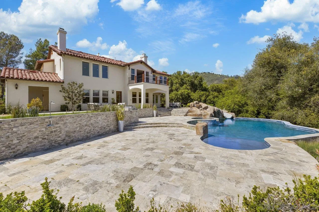 20919 Questhaven Road San Marcos, CA 92078 - Photo 33 of 54 a view of a white house with a yard