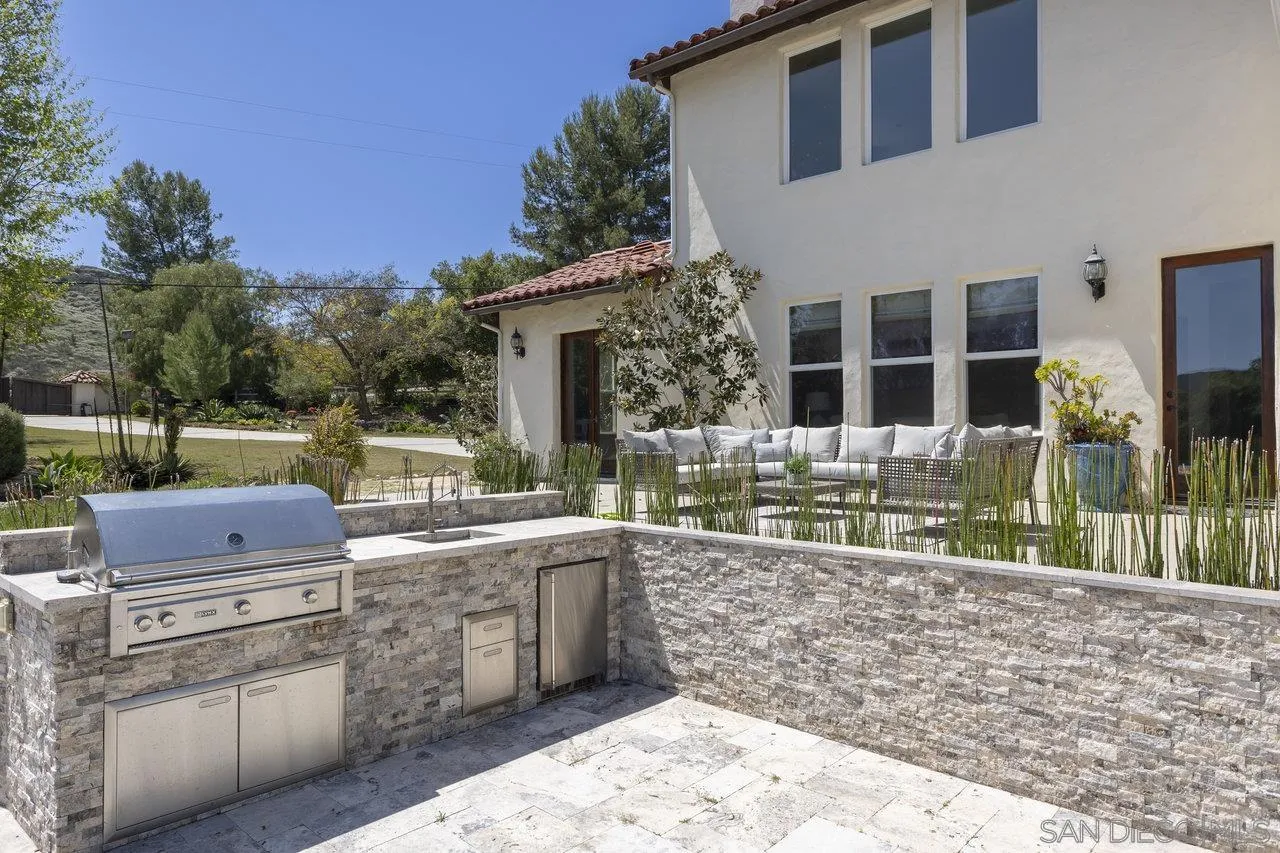 20919 Questhaven Road San Marcos, CA 92078 - Photo 34 of 54 a view of a house with backyard and sitting area