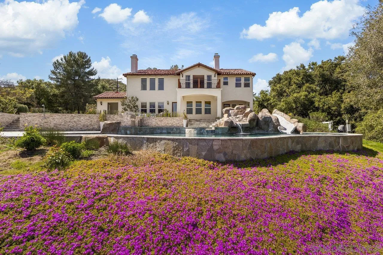 20919 Questhaven Road San Marcos, CA 92078 - Photo 4 of 54 a view of a fountain in front of house