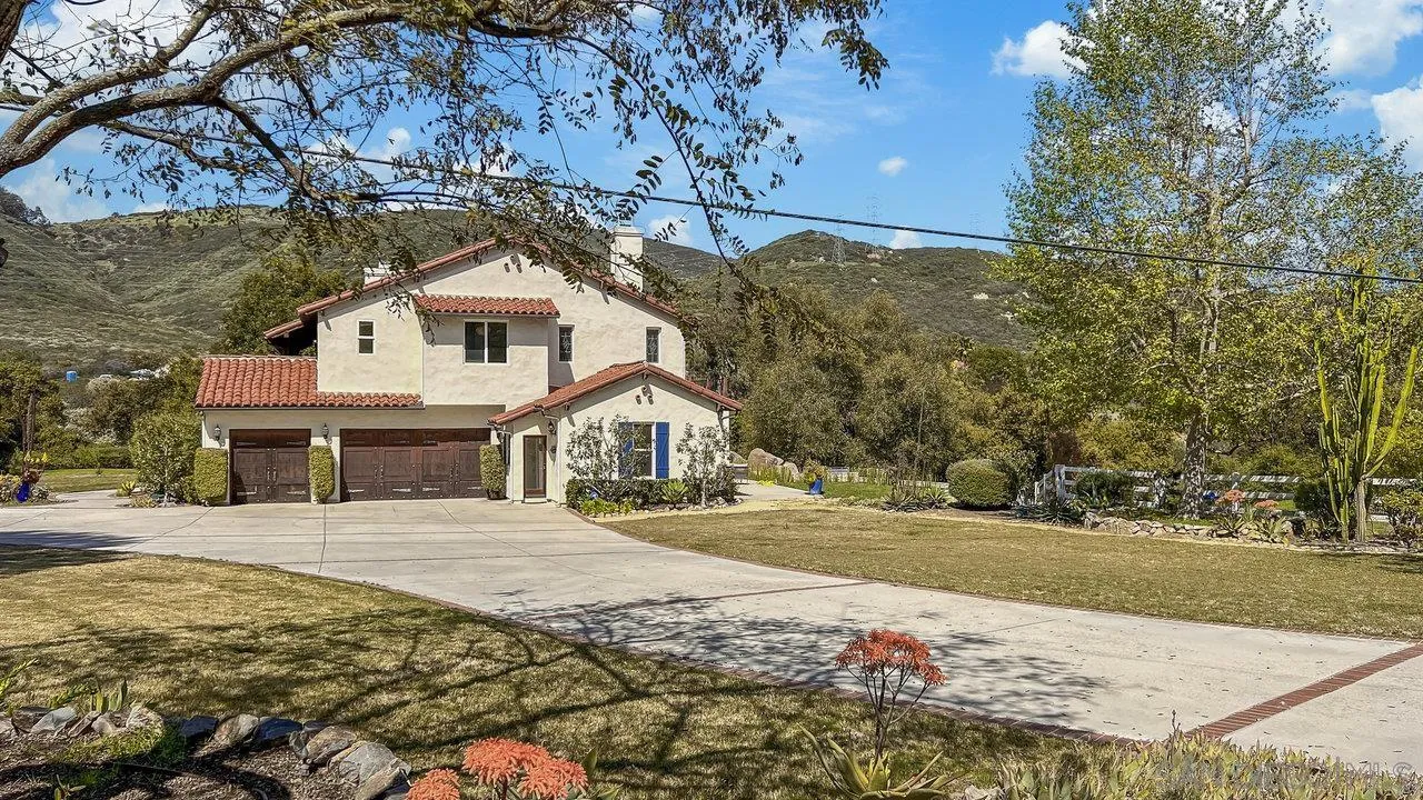 20919 Questhaven Road San Marcos, CA 92078 - Photo 6 of 54 a front view of a house with a yard