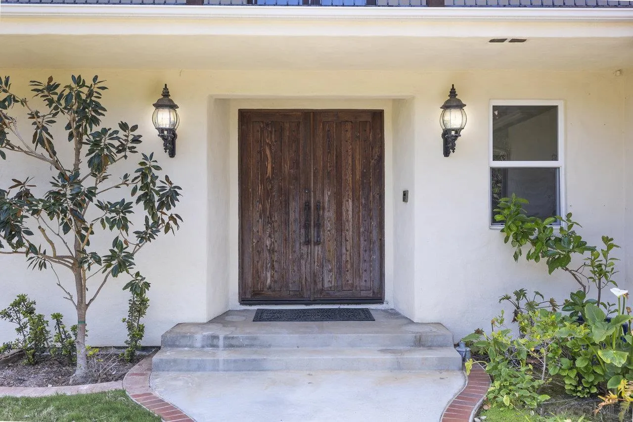 20919 Questhaven Road San Marcos, CA 92078 - Photo 7 of 54 a view of a entryway door of the house