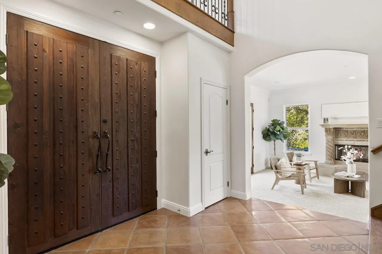 20919 Questhaven Road San Marcos, CA 92078 - Photo 9 of 54 a view of a hallway with dining area and entryway