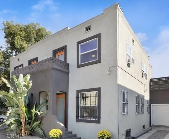 a front view of a building with garden