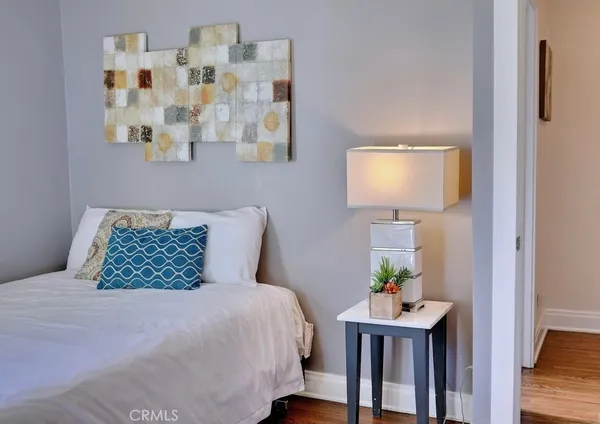 a bedroom with a bed and a table in it