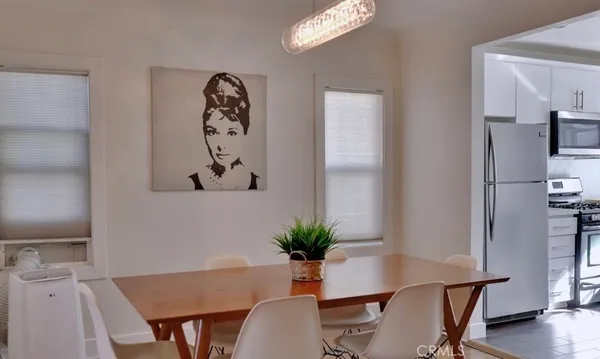 a view of a workspace room with furniture and wooden floor