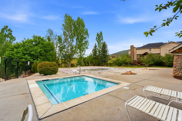 3634 North Huntsman Path, Unit C203 Eden, UT 84310 - Photo 16 of 27 Concrete patio surrounding a square spa with tiled trim