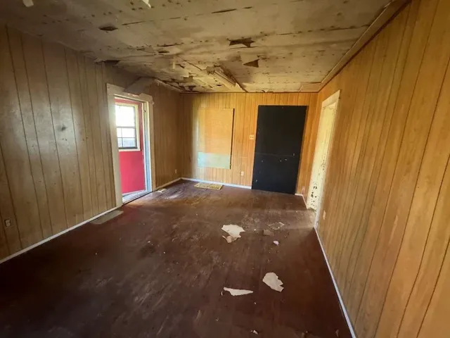 a view of a big room with windows