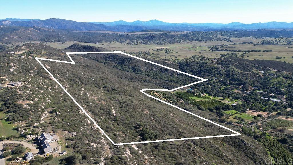 26285 Oak Trail Road Valley Center, CA 92082 - Photo 3 of 5 a view of a backyard with mountain view and mountain view