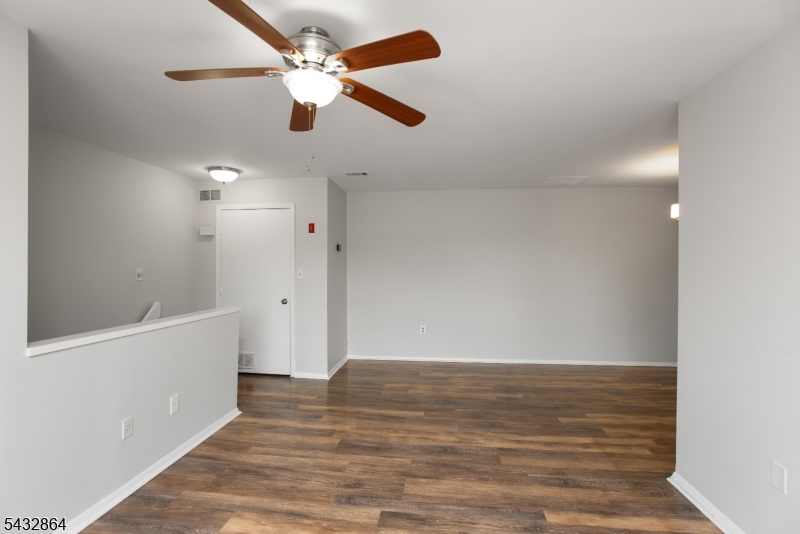504 Nottingham Way, Unit 504 Flemington, NJ 08822 - Photo 10 of 12 wooden floor in an empty room