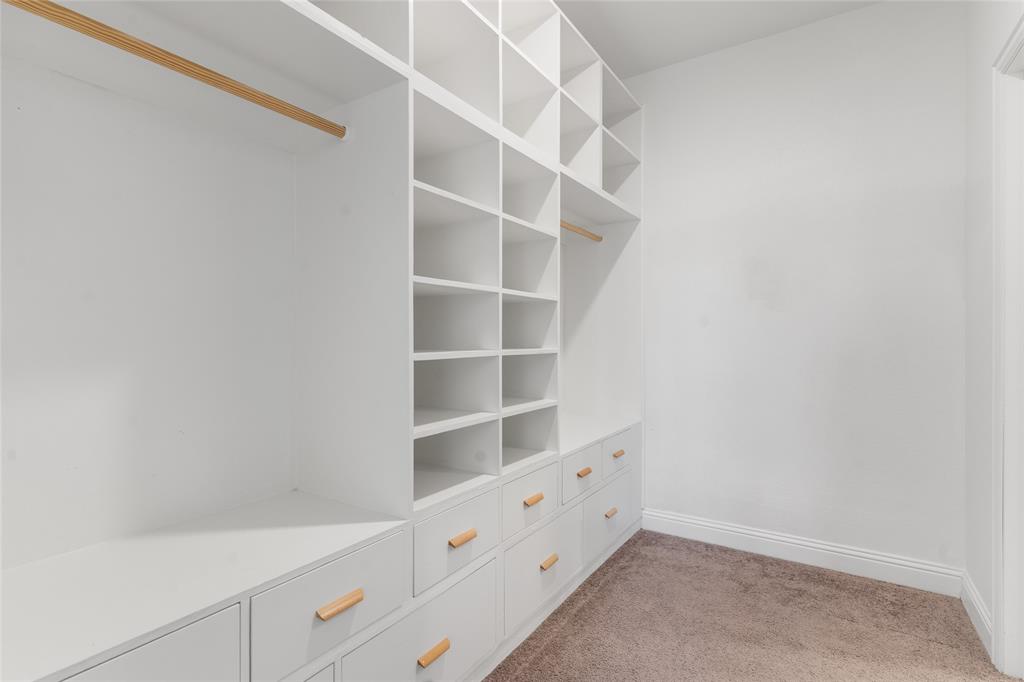 4117 Mockingbird Lane Melissa, TX 75454 - Photo 10 of 24 a room with a cabinets and a window