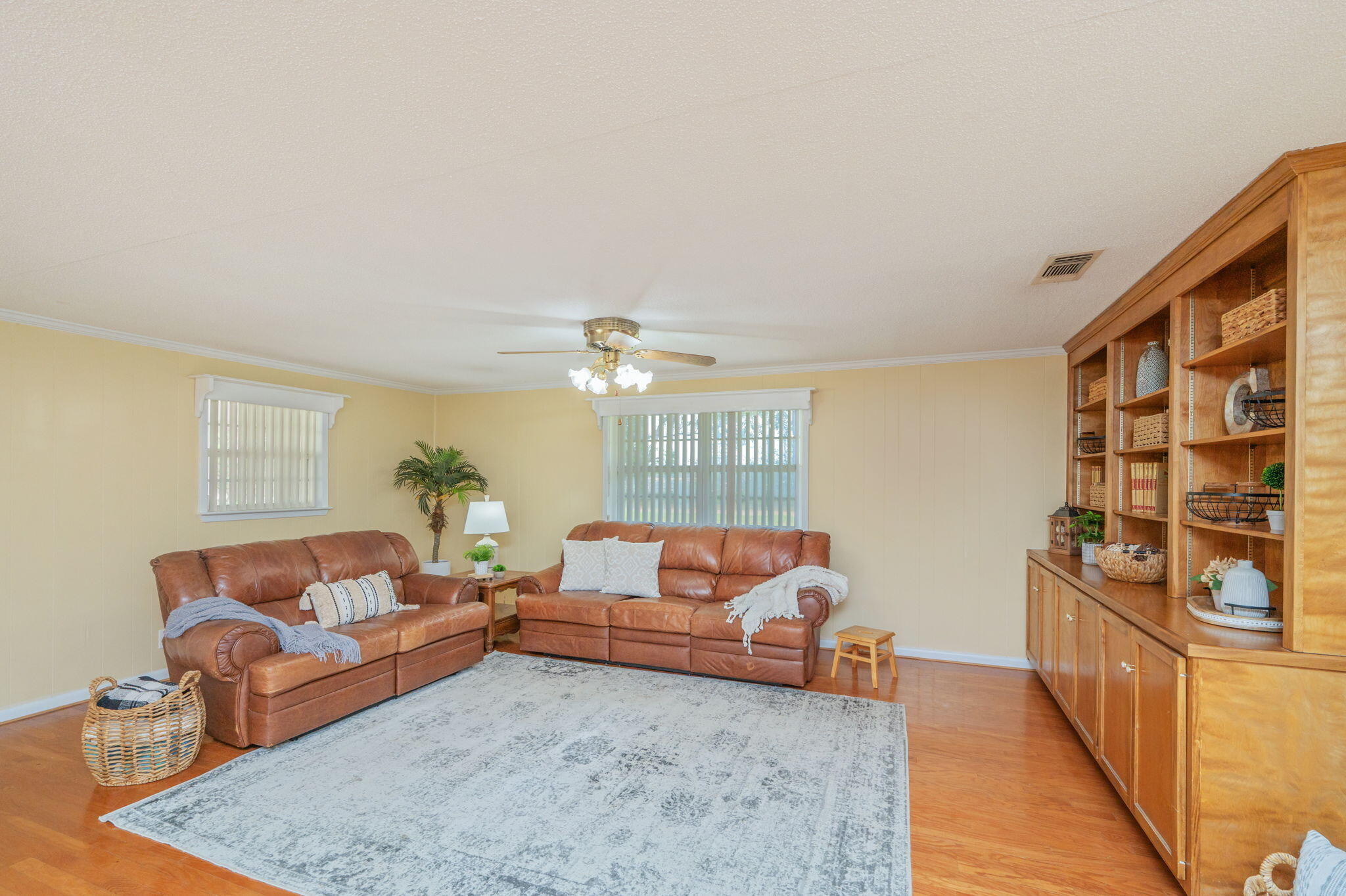 501 Jones Road Crestview, FL 32536 - Photo 6 of 32 a living room with furniture a rug and a chandelier