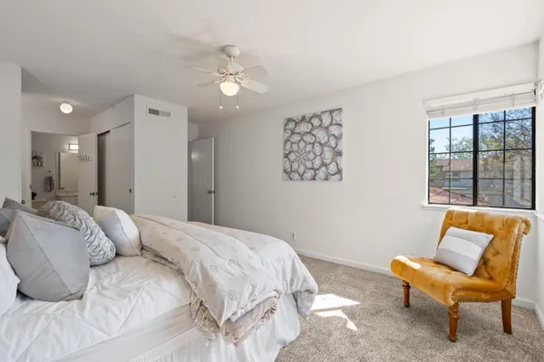 a bedroom with a bed and a couch