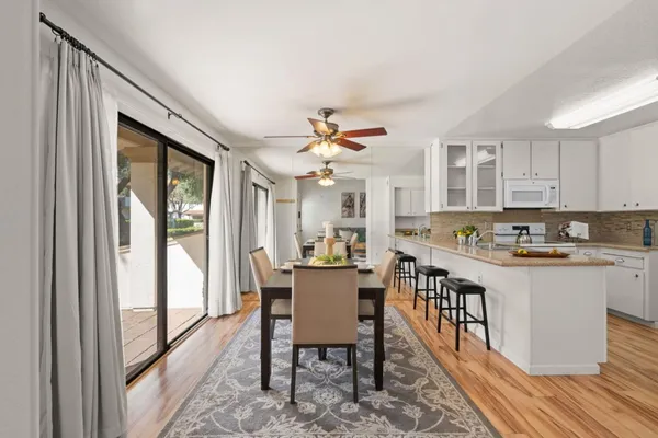 a view of a dining room with furniture window and outside view