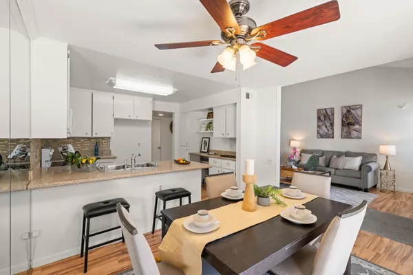 a kitchen with a dining table and chairs