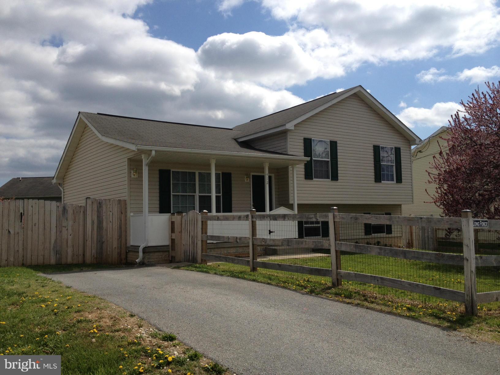 412 East 10th Avenue Ranson, WV 25438 - Photo 1 of 27 a front view of a house with a yard
