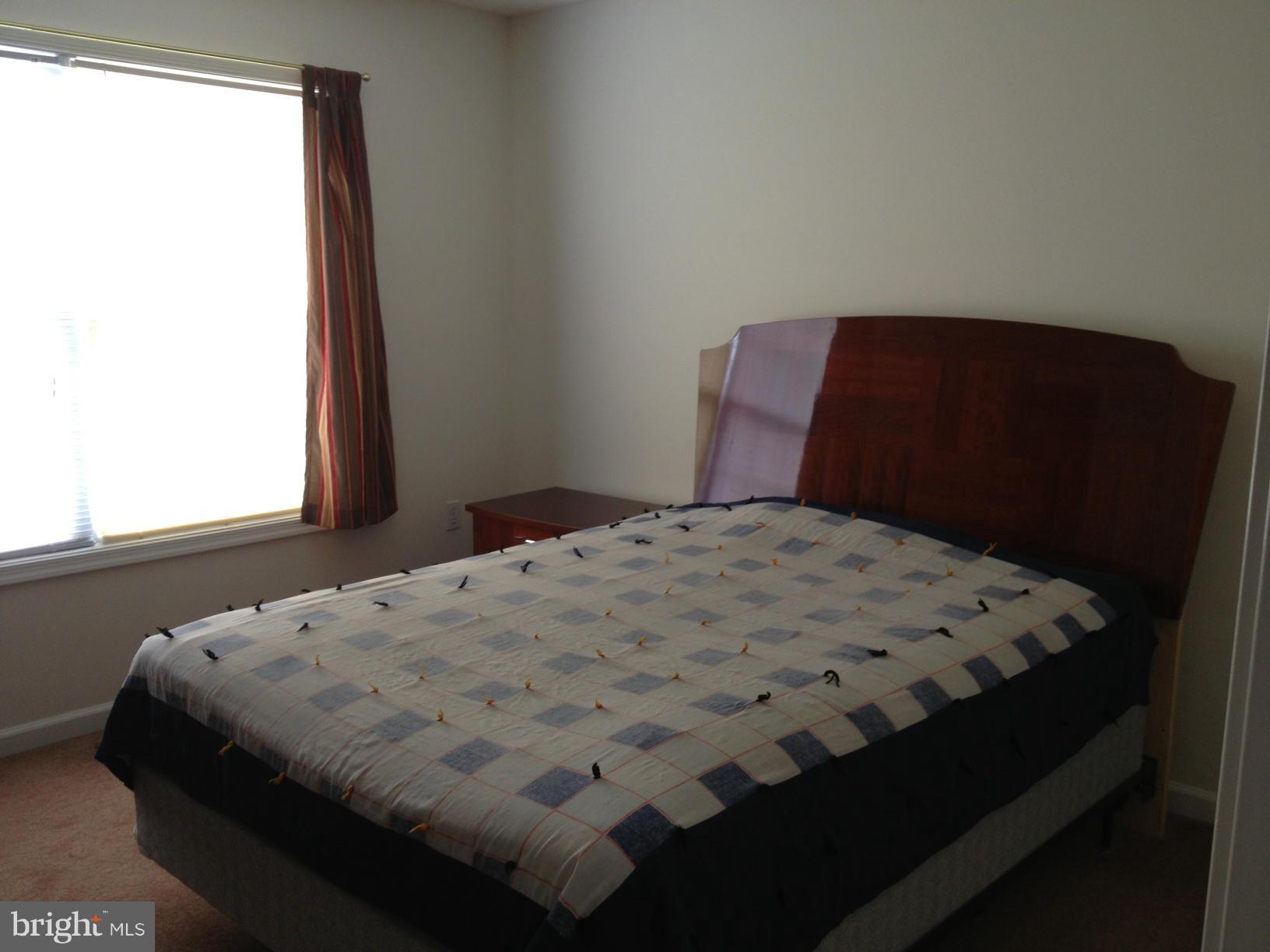 412 East 10th Avenue Ranson, WV 25438 - Photo 12 of 27 a bedroom with a bed and window