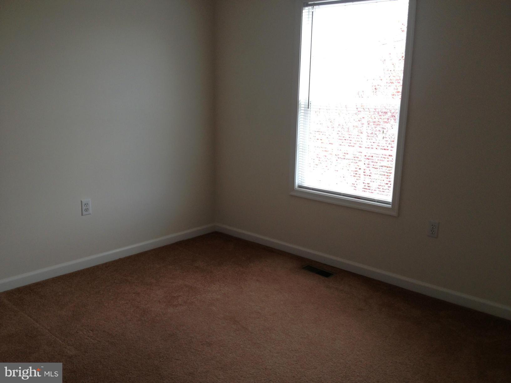 412 East 10th Avenue Ranson, WV 25438 - Photo 19 of 27 an empty room with a window