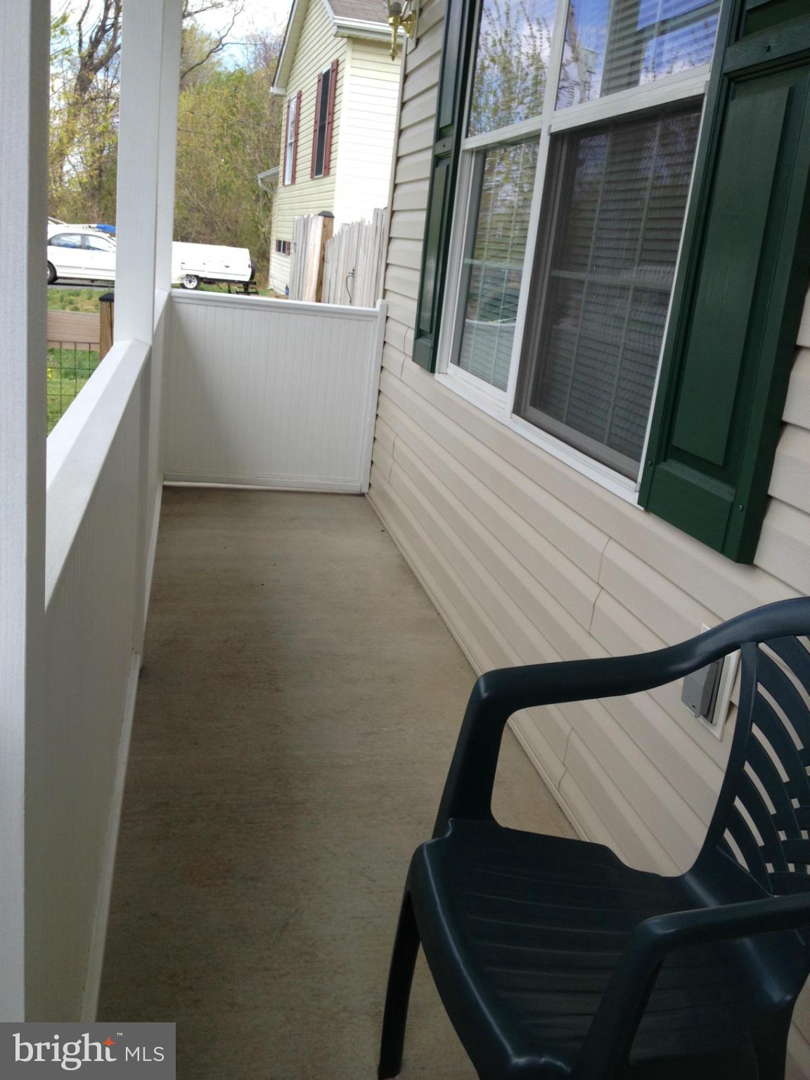 412 East 10th Avenue Ranson, WV 25438 - Photo 3 of 27 a view of balcony with wooden floor and a sink