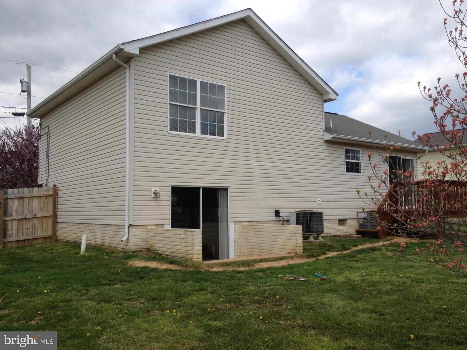 412 East 10th Avenue Ranson, WV 25438 - Photo 24 of 27 a view of a house with a backyard