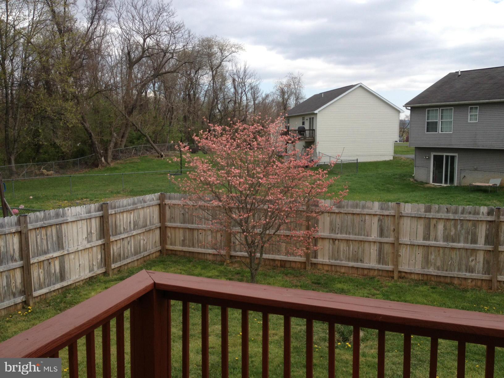 412 East 10th Avenue Ranson, WV 25438 - Photo 26 of 27 a view of a wooden fence and a big yard
