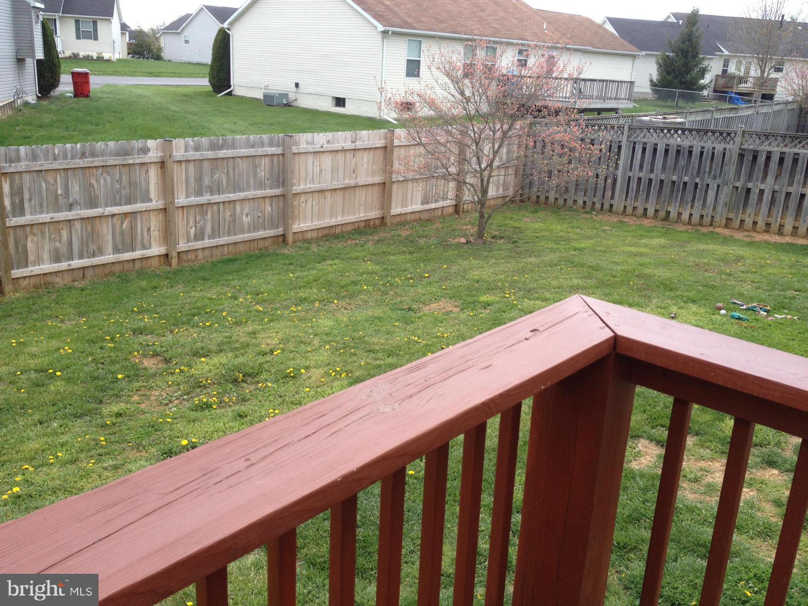 412 East 10th Avenue Ranson, WV 25438 - Photo 27 of 27 a view of a backyard with a wooden fence