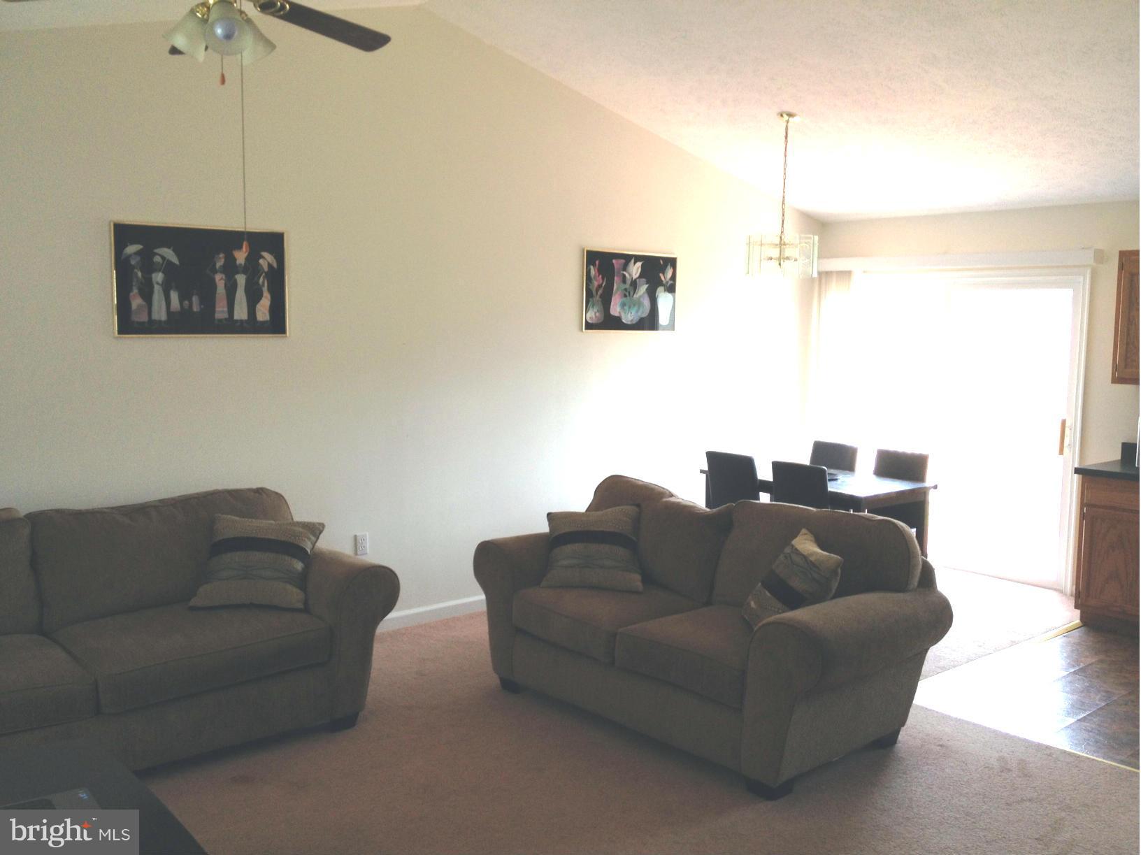 412 East 10th Avenue Ranson, WV 25438 - Photo 6 of 27 a living room with couches and a coffee table