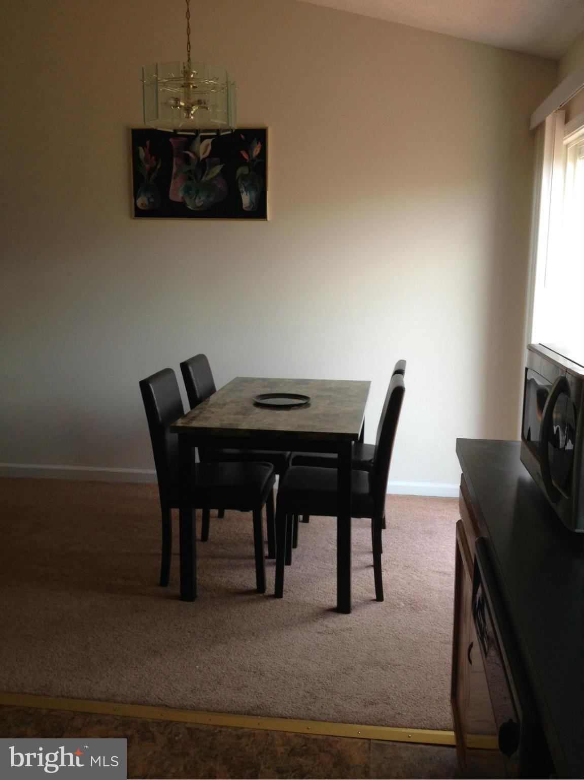 412 East 10th Avenue Ranson, WV 25438 - Photo 8 of 27 a view of a dining room with furniture