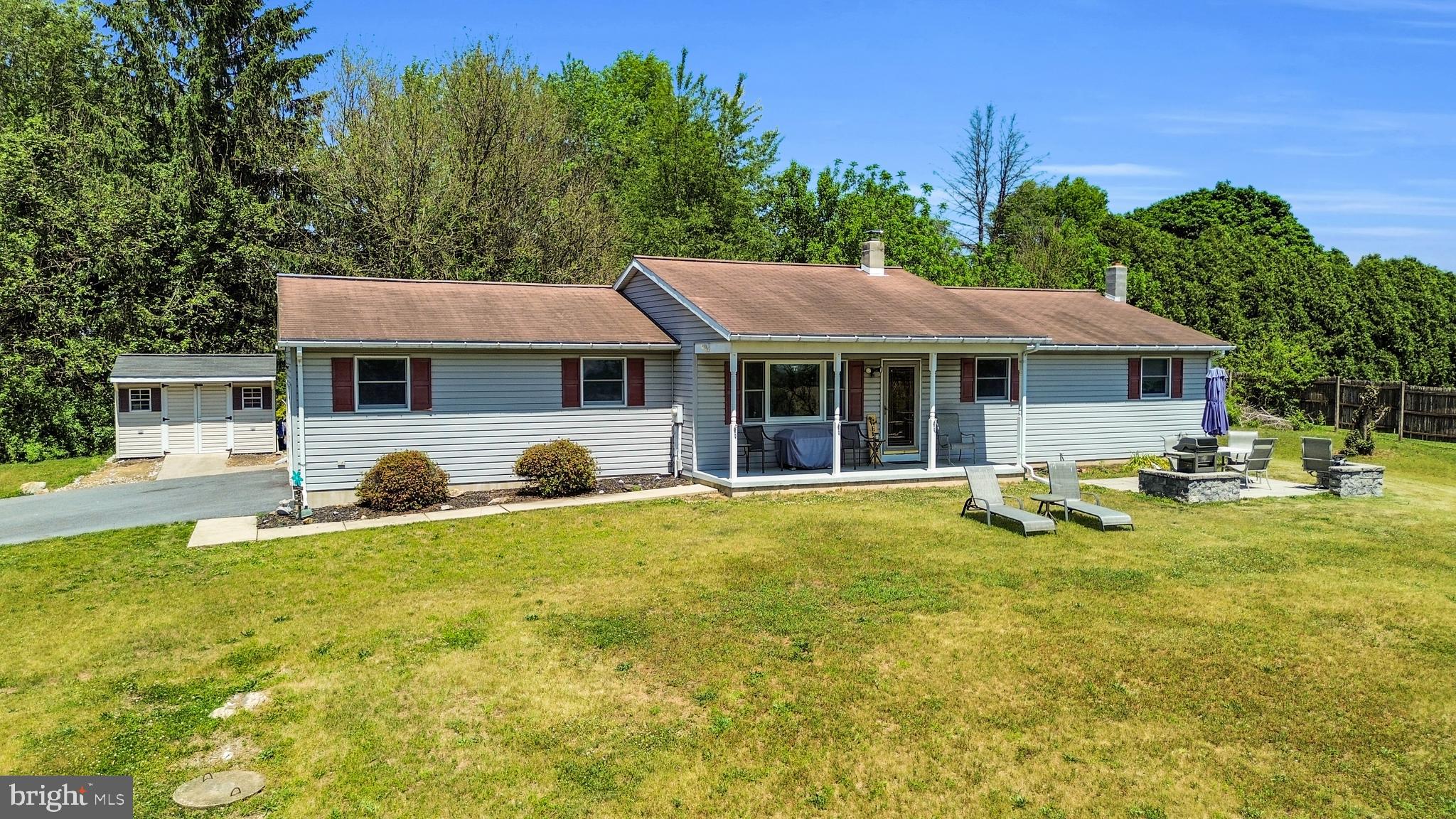 97 Bertolet Mill Road Oley, PA 19547 - Photo 2 of 35 a view of a house with swimming pool and sitting area