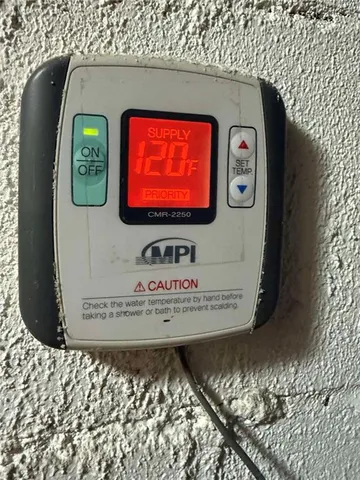 a view of backyard with seating space and trees