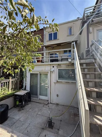 a view of a park with large trees