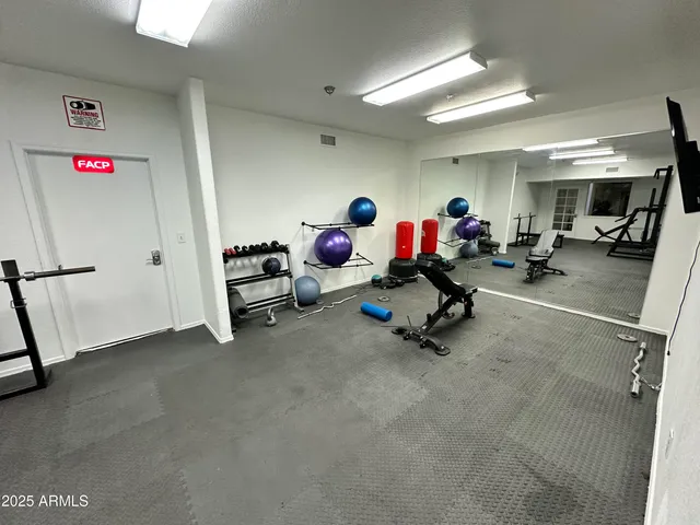 a room with furniture pool table and window