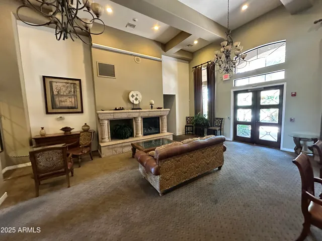 a living room with pool table and a wooden floor