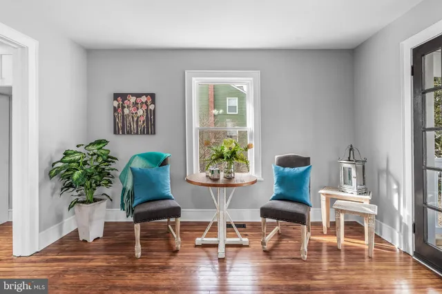a bedroom with a bed and a book shelf