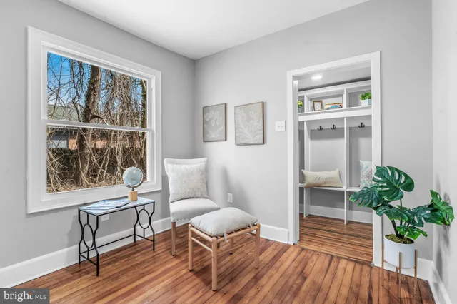 a kitchen with granite countertop a sink a counter space stainless steel appliances and windows