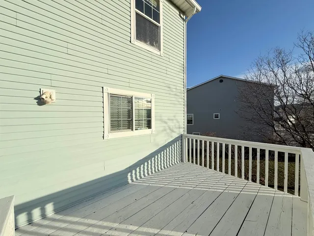 a view of balcony with wooden floor
