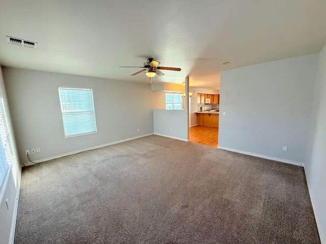 a view of a livingroom with a kitchen