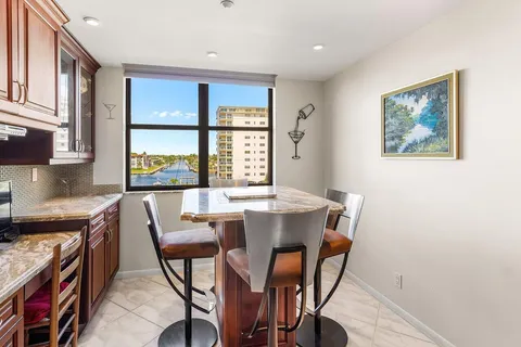 a bedroom with a bed next to a window with television