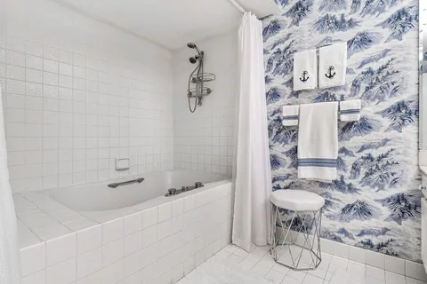 a room with furniture and a book shelf