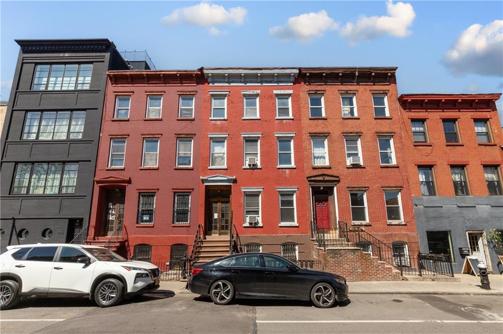 264 Berry Street Brooklyn, NY 11249 - Photo 1 of 21 a car parked in front of a building