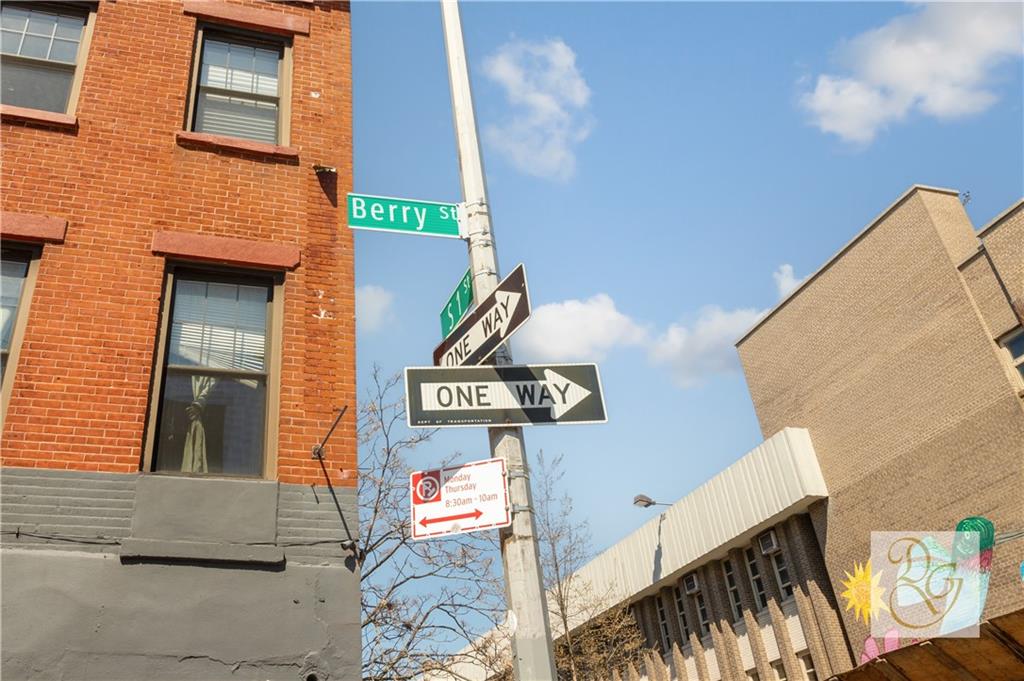 264 Berry Street Brooklyn, NY 11249 - Photo 13 of 21 a street sign on a brick wall