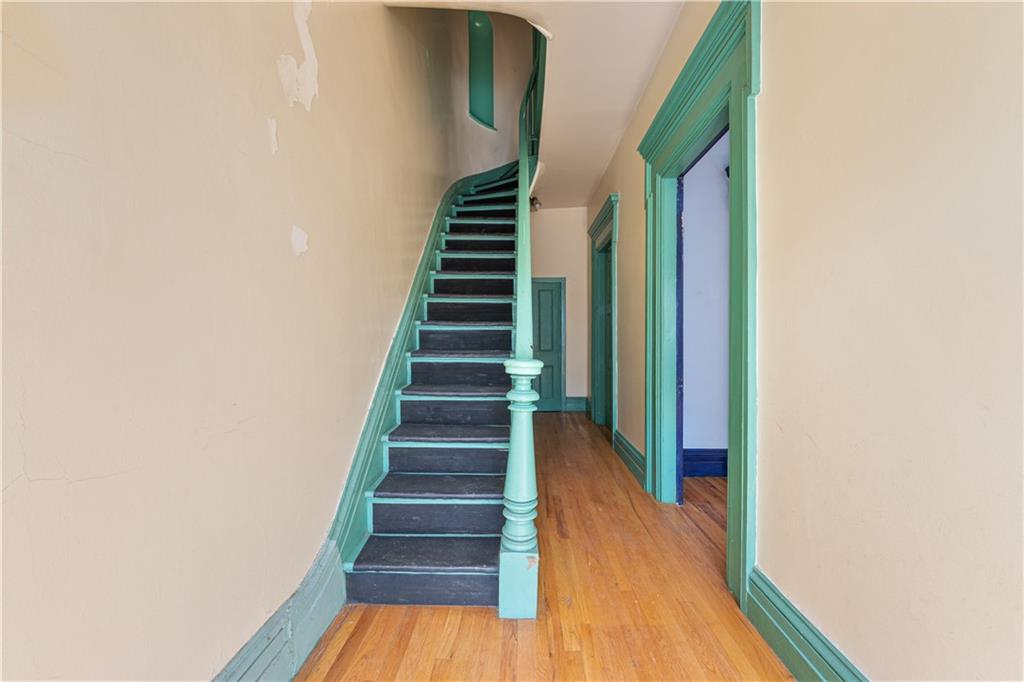 264 Berry Street Brooklyn, NY 11249 - Photo 3 of 21 a view of a hallway with wooden floor