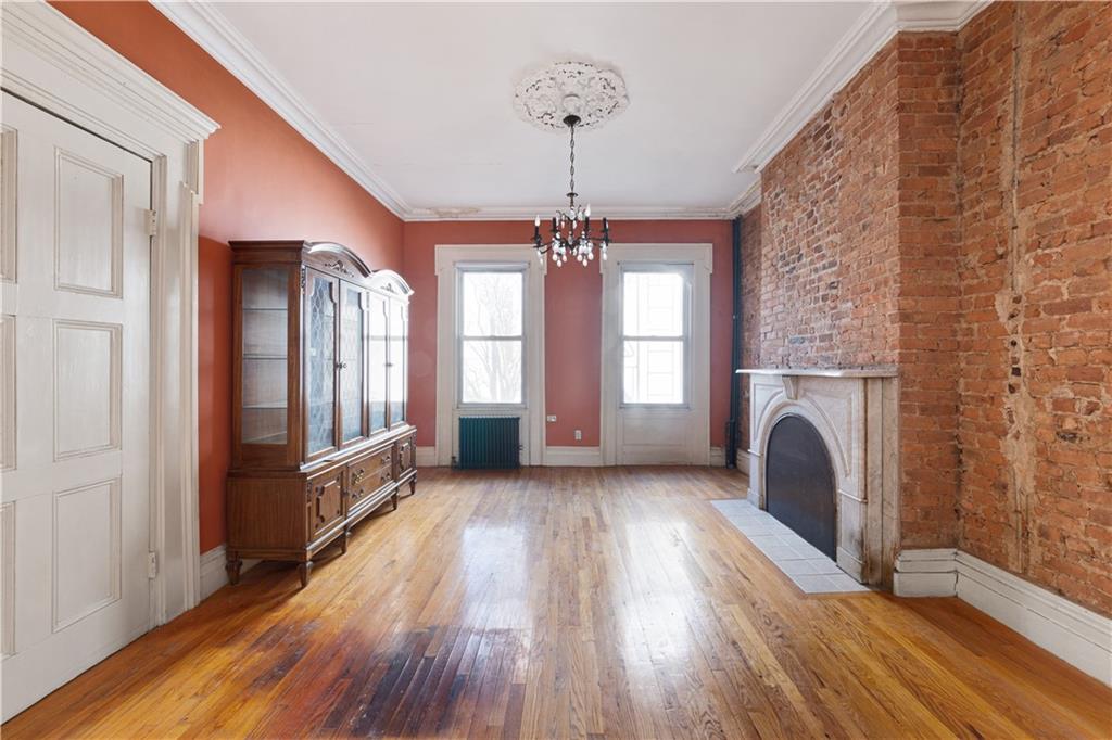 264 Berry Street Brooklyn, NY 11249 - Photo 6 of 21 a view of a hallway with windows and chandelier in a room