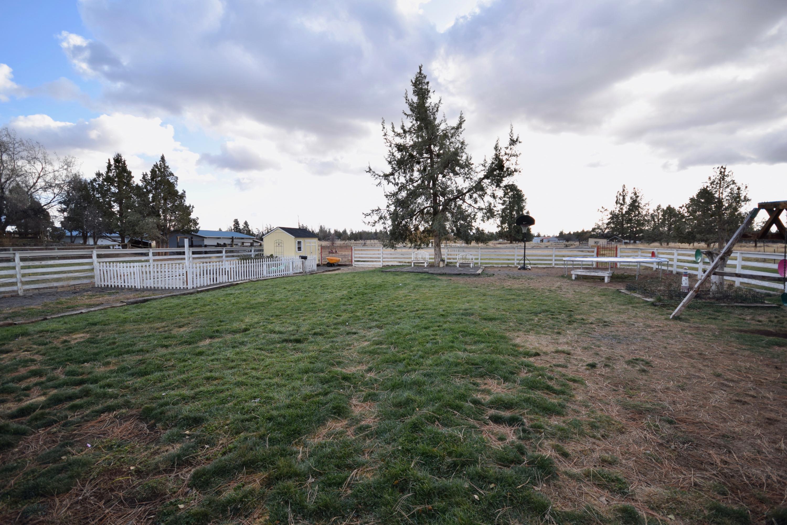 22169 Nelson Road Bend, OR 97701 - Photo 38 of 42 a view of grassy field with trees